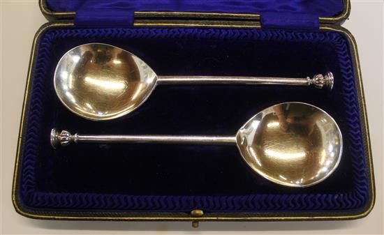 Cased pair of silver seal top spoons